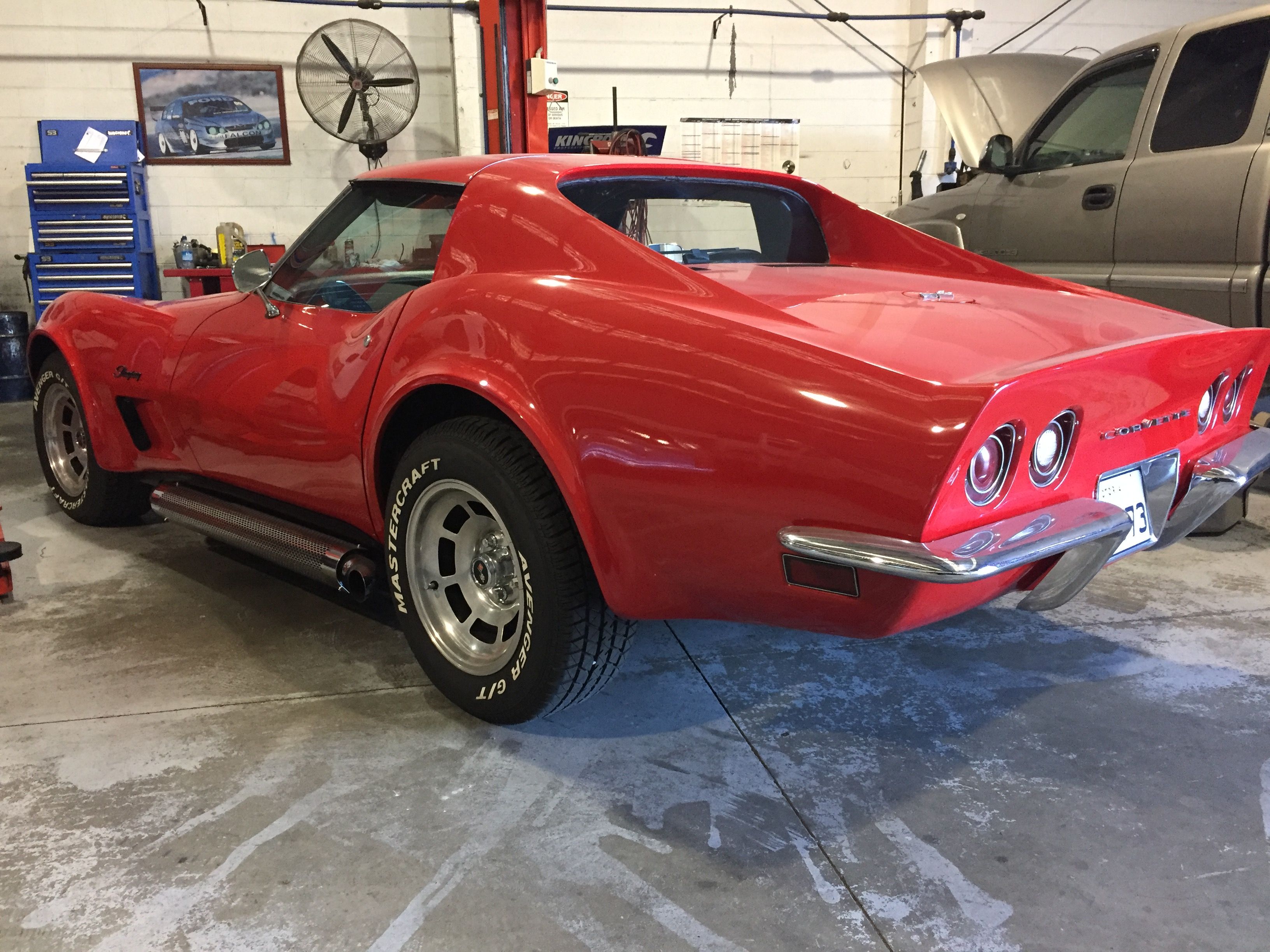 Red classic Corvette inside the Superior Mechanical workshop